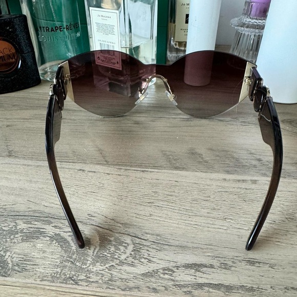 Brown oversized square sunglasses with gradient lenses and thick temple arms